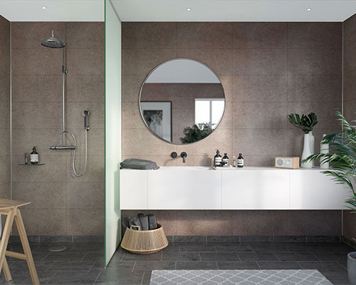 Natural themed bathroom with a large round mirror above the sink