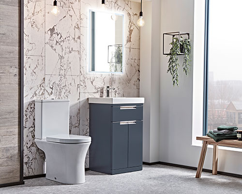 Bathroom with a grey marble effect tiles on the wall