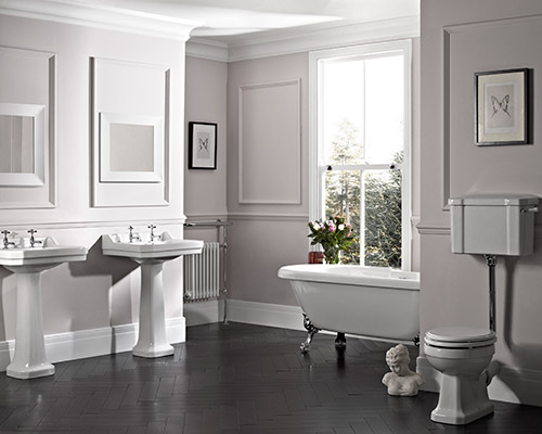 An elegant bathroom, with dual sink and a claw foot bath tub